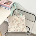 Detailed quilted texture of a white canvas tote bag with cute puppy and bow patterns - Latte Blue Dog