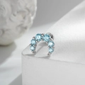 Silver crescent moon stud earring with light blue zircons on a white textured stand - Light Blue Moon Style (A1031-3)