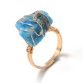 Handmade wire wrapped ring with irregular blue raw stone and adjustable gold band - Apatite
