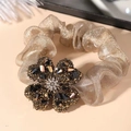 Elastico per capelli con quadrifoglio di strass scintillanti in mesh oro champagne - Caffè Dorato