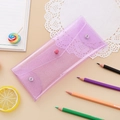 Macro view of pink glitter laser pencil case with snap button closure and PVC material - Glitter Purple