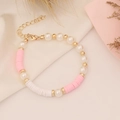 Detail of bohemian bracelet with pink and white clay beads and imitation pearls - Pink