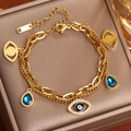 Pulsera de doble cadena dorada con amuletos de ojo turco y cristales en joyero elegante - Dorado