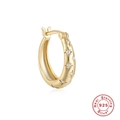 Detail of a 925 sterling silver gold hoop earring with star-shaped cubic zirconia stones - Single Gold #3 (11mm)