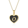 Detailed macro of gold heart pendant with black enamel inlay and letter O on a chain - Letter O Style