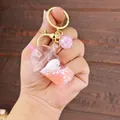 Pink milk tea acrylic keychain with floating seal inside and sparkling beads - Pink (Pink Milk Tea Spotted Seal)