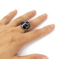 Detail of handmade silver wire wrapped tree of life ring with round black natural stone - Obsidian