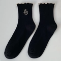 Black cotton crew socks with beige floral embroidery and ruffled wood ear edges - Black / One Size