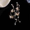 Elegant silver butterfly tassel earrings with white pearls on a black velvet background - 104# Gold Artificial Pearl Butterfly Tassel