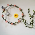 Pink fabric rose flower crown with green leaves on brown rattan for beach hair styling - Nude Pink