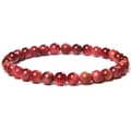 Macro view of polished red tiger eye beads with distinct cat-eye optical effect - 6mm Orange Red Tiger Eye