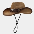 Detail of western straw cowboy hat featuring a silver bull head metal accessory on leather band - One Size / Bull Head Brown Decor Dark Khaki