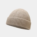 Close-up of the light khaki ribbed knit texture on a minimalist retro beanie hat - One Size / Khaki