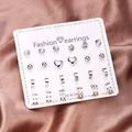 12 pairs of silver alloy stud earrings set with crystal rhinestones on display card - Silver Heart Zirconia Ball Hollow Ring Set (ER23Y0958-2)