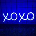 Blue XOXO LED neon light wall decoration mounted on a metal grid with vivid glow - Blue
