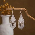 Detailed close-up of retro silver drop earrings with peacock-style fringes on wooden branch - Silver Rhombus 5-Bead Tassel(E2875-32)