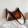 Brown transparent PVC jelly shoulder bag with curved design and glossy finish - Brown