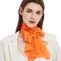 Elegant bright orange chiffon long scarf tied in a large bow on white shirt - Vitality Orange