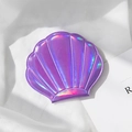 Portable holographic purple shell-shaped pocket mirror with radiant texture and pearlescent finish - Purple