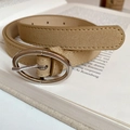 Minimalist khaki suede belt with a silver oval buckle displayed on an open book - 71# Waist Chain - Beige
