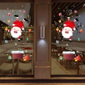 Détail d'autocollants de Noël avec Père Noël et cadeaux pour décoration de vitrine festive - Père Noël à l'Envers Avec Cheminée (6282)