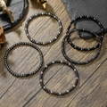 Handmade beaded bracelet set with black hematite stones and silver metallic beads on wood - Multi Layer Black Silver Disk Round Beads Combo