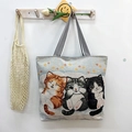 Cute canvas tote bag featuring three cartoon cats with striped handles for daily shopping - Three Cute Cats