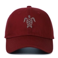 Macro detail of high-quality cotton turtle embroidery on a burgundy baseball cap - Burgundy