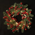 Christmas wreath featuring red berries, pine needles, plaid bow, and warm LED lights - Wreath (With LED Lights)