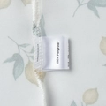 Detail of 100% polyester fabric floral print and high-quality stitching on sundress - Polyester (Lemon Print White)