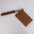 Brown washed canvas coin purse with a matching wristlet strap and metallic zipper detail - Camel