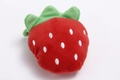 Plush squeaky dog toy in a bright red strawberry shape with green leaf details - Red Strawberry
