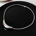 Vintage silver snake chain necklace with a polished curved pendant on black plate - 44# Necklace - Silver - Minimalist Curved Snake Bone Chain