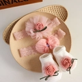 Detailed shot of pink lace baby headbands and matching socks in a ceramic dish - 4647 Pink Rose Headband + Socks