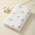 Folded white cotton gauze baby blanket featuring a cute red cherry print pattern - 100*100cm / Cherry Red