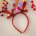 Close-up of glowing LED Christmas headband with red glitter antlers and festive hat - 24# Adult Red Glitter Antler Headband