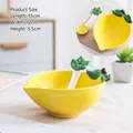 Yellow lemon ceramic salad bowl set with green leaf spoon and textured surface - Lemon Bowl