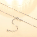 Macro detail of silver necklace chain with lobster clasp extension and teardrop charm - XL1196 Gypsophila Star Chain
