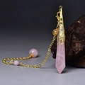 Macro view of rose quartz hexagonal pendant with vintage gold cap and chain - Gold Rose Quartz