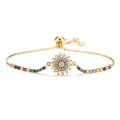 Adjustable gold sunflower bracelet featuring colorful cubic zirconia stones on white background - Sunflower Gold