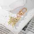 Elegant gold butterfly keychain with pink crystal stone on textured stone background - Pink Rhinestone Gold Butterfly