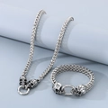 Set di gioielli punk in argento con collana e bracciale a catena intrecciata e teschi - Bracciale 19cm + Collana 45cm / Argento