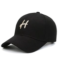 Classic black baseball cap with embroidered H logo on front from a 45-degree angle - Black