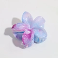 Detailed macro view of plumeria hair claw clip with blue and purple gradient resin petals - 6cm Purple