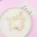 Cute yellow plush teddy bear with white heart embroidery and closed-eye expression - Single Bear / Yellow Bear