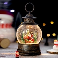 Lanterna natalizia in bronzo con palla di neve, scena di Babbo Natale e luce LED integrata - Babbo Natale sulla slitta