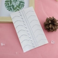 Silver crescent moon and dot rhinestone face stickers on a pink decorative background - Crescent Moon Nose Bridge Stickers