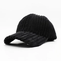 Close-up of black corduroy baseball cap showing thick striped texture and soft fabric - Black