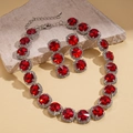 Detail of red ruby style necklace and earrings set with crystal pavé on stone surface - Necklace-Red (Two-piece Set)