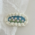Detailed macro view of handmade crochet flower hairpin with light blue embroidery work - Crochet-White Flower Cluster